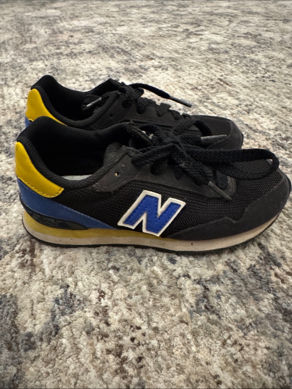 New Balance Black Sneakers with Blue and Yellow Accents